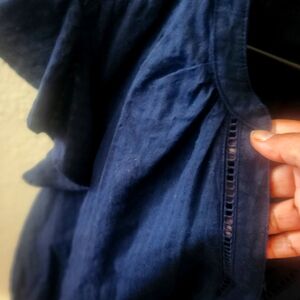 A Navy Blue blouse with ruffles sleeves